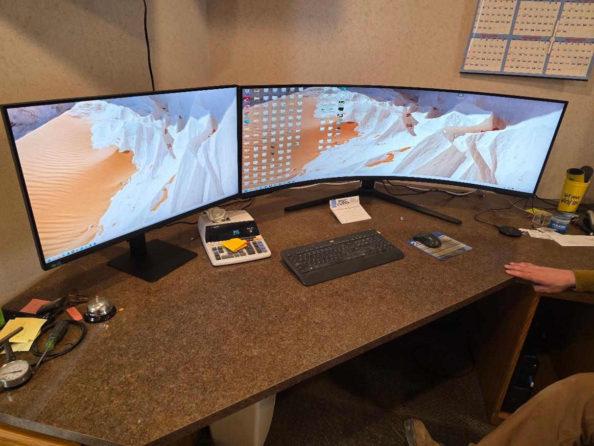 Dual curved monitor command center for security feed monitoring